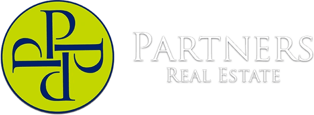 A green banner with the words partners real estate in white.
